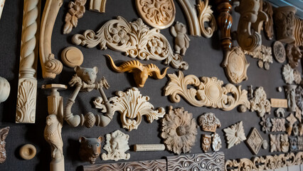 carving element. furniture in classic style. white color wood with gold trim. patina. carving. small depth of field. luxury furniture. use as background.