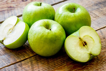 green apples for healthy dessert on wooden background