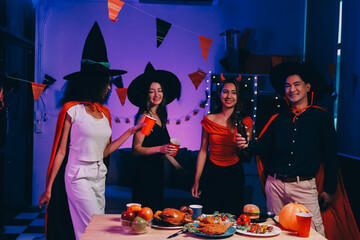 Joyful office Halloween party with coworkers in costumes, celebrating with drinks and laughter, fostering teamwork and festive spirit