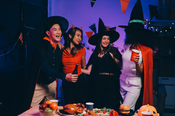 Joyful office Halloween party with coworkers in costumes, celebrating with drinks and laughter, fostering teamwork and festive spirit