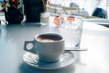 Coffee in white cup at a cafe