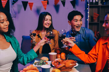 Joyful office Halloween party with coworkers in costumes, celebrating with drinks and laughter, fostering teamwork and festive spirit