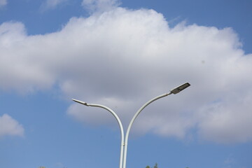 street lamp against blue sky
