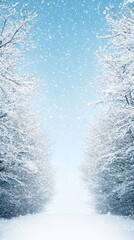 Snowy winter landscape with tall trees under a blue sky and falling snowflakes, serene and tranquil scene.