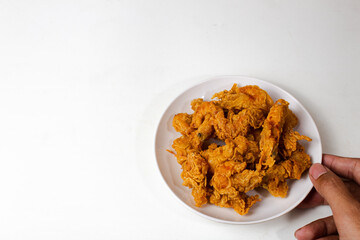 Crispy prawns are served on a plate in the lower right corner