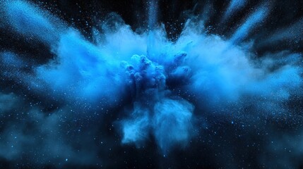 Naklejka premium A vibrant blue explosion of powder creates a stunning visual effect against a dark background, evoking a sense of energy and movement.