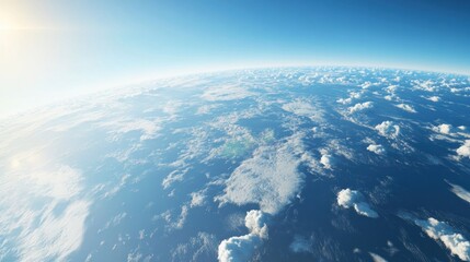 A breathtaking view of Earth from space, showcasing the vibrant blue oceans and fluffy white clouds under a bright sky.