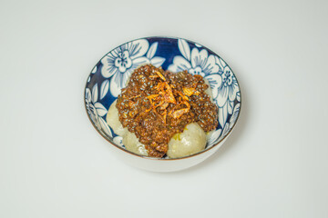 Cilok with peanut sauce. Cilok is a ball-shaped dumpling made from tapioca flour, a typical Sundanese snack originating from Indonesia. 