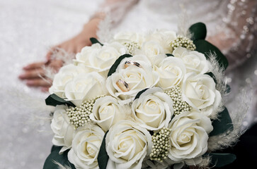 Wedding rings in bouquet