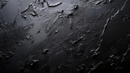 Fototapeta premium Textured black surface with a modern and artistic look, perfect for background or abstract design.