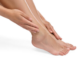 Woman touching her smooth feet on white background, closeup