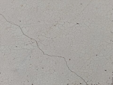 Cracked and Weathered White Surface with Fine, Dried Patterns, Highlighting Natural Wear, Aging, and Subtle Fragility