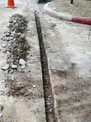 Concrete road cutting work to install electrical systems