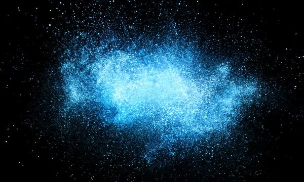 Abstract blue particle explosion creating a glowing effect on a dark background with scattered tiny dots