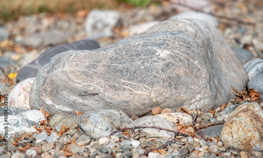 Wall mural a large rock sits on a pile of rocks