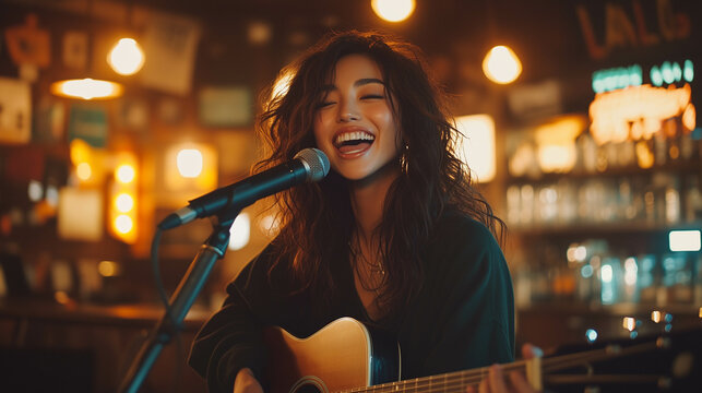 Close-up of a young, beautiful Asian girl passionately singing at the bar
