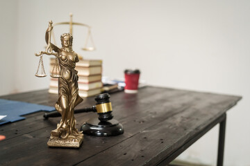 A lawyer's desk in the office is filled with legal documents.The lawyer provides consultations on civil criminal law,contract management, inheritance, notary public services,temporary bail requests.