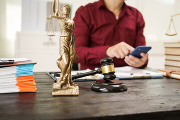 A male lawyer is working at his desk on an online judicial review, focusing on justice, fairness, and legal compliance.He reviews cases, contracts, and legal matters based on general law principles