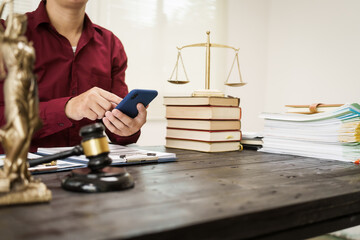 A male lawyer is working at his desk on an online judicial review, focusing on justice, fairness, and legal compliance.He reviews cases, contracts, and legal matters based on general law principles