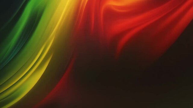 Black History Month, Juneteenth day background. Soft silk fabric flag in red, yellow, green colors waving on black background
