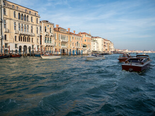 Boats sailing in Venice, Italy.