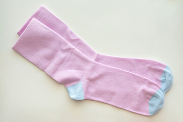 Fototapeta premium Purple cotton sport socks on white background
