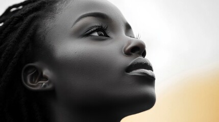 Fototapeta premium A young woman gazes thoughtfully at the horizon