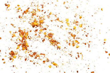 dried red chili pepper flakes and seeds isolated on white background
