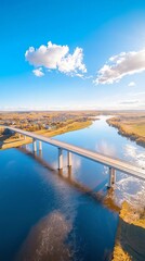 Stunning Drone View of a Bridge Over a Wide River Connecting Two Vibrant Towns