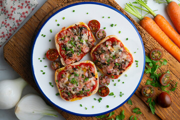 Ham and mini pizzas with mushrooms. Top view table with  decoration.