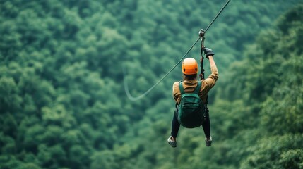 A brave adventurer rides a zip line through lush green mountains, showcasing the thrill of outdoor exploration.