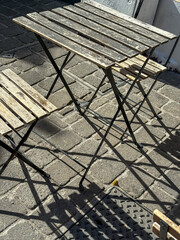 the beginning of autumn, street chairs, fallen yellow leaves