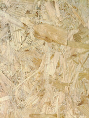 Close-up of a pressed wood panel with a nice fiber structure on the whole background. Building and finishing material