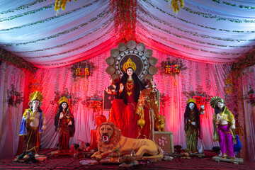 A beautiful idol of Maa Durga being worshipped at a pandal during Navratri. Navratri is biggest...