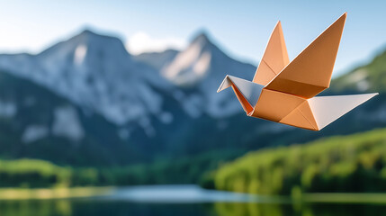 An origami bird gracefully flies over serene landscape with majestic mountains and tranquil lake, evoking sense of peace and freedom