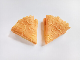 Kue semprong, Asian egg roll, sapit, sepit or kapit. Indonesian traditional wafer snack made by clasping egg batter using an iron mold.