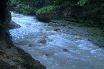Beautiful views of the flowing river at Tapkeshwar Temple in Dehradun from different angles.