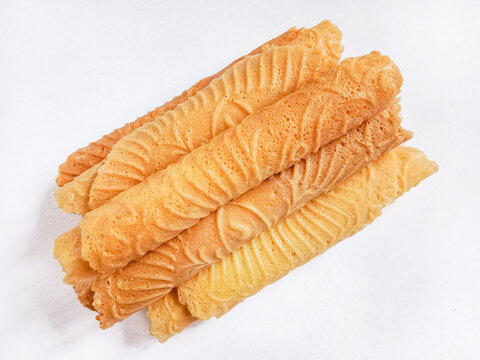 Kue semprong, Asian egg roll, sapit, sepit or kapit. Indonesian traditional wafer snack made by clasping egg batter using an iron mold.