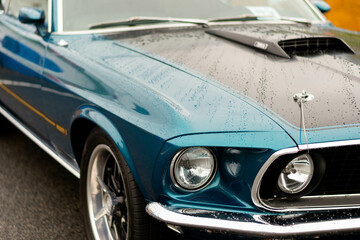 Close up of a classic blue car.