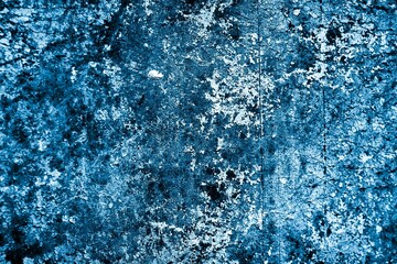 blue wall painted with white old peeling paint