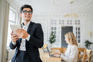 Business Professionals Engaging in Teamwork at a Modern Office During the Day With Technology and Collaboration