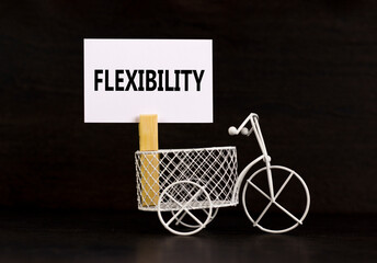 Flexibility symbol. Concept word Flexibility on beautiful white paper on clothespin. Beautiful...