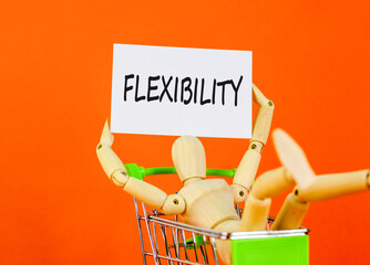 Flexibility symbol. Concept word Flexibility on beautiful white paper. Beautiful orange background....
