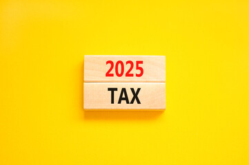 Naklejka premium Planning 2025 tax new year symbol. Concept words 2025 Tax on beautiful wooden blocks. Beautiful yellow background. Business 2025 tax new year concept. Copy space.