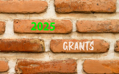 Planning 2025 grants new year symbol. Concept words 2025 Grants on beautiful brown brick wall. Beautiful brown brick wall background. Business 2025 grants new year concept. Copy space.