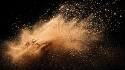 Sand explosion isolated on black background. Freeze motion of sandy dust splash