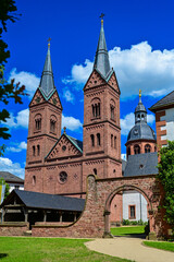 The church Basilica Seligenstadt St. Marcellinus and St. Peter of the monastery Seligenstadt as a parish church with blue sky and sunshine in summer, Seligenstadt, Hessen, Germany