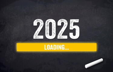 Black chalkboard with yellow loading bar and message Loading 2025
