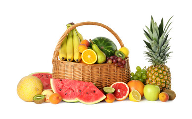 Many different fresh fruits in wicker basket isolated on white