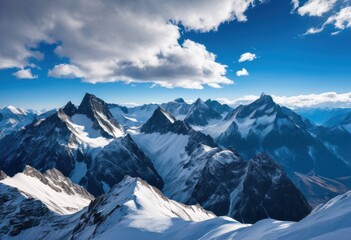 Obraz premium majestic mountain peaks surrounded dynamic cloud patterns illuminated beautiful sunlight under vibrant blue sky, altitude, landscape, summit, view, panorama